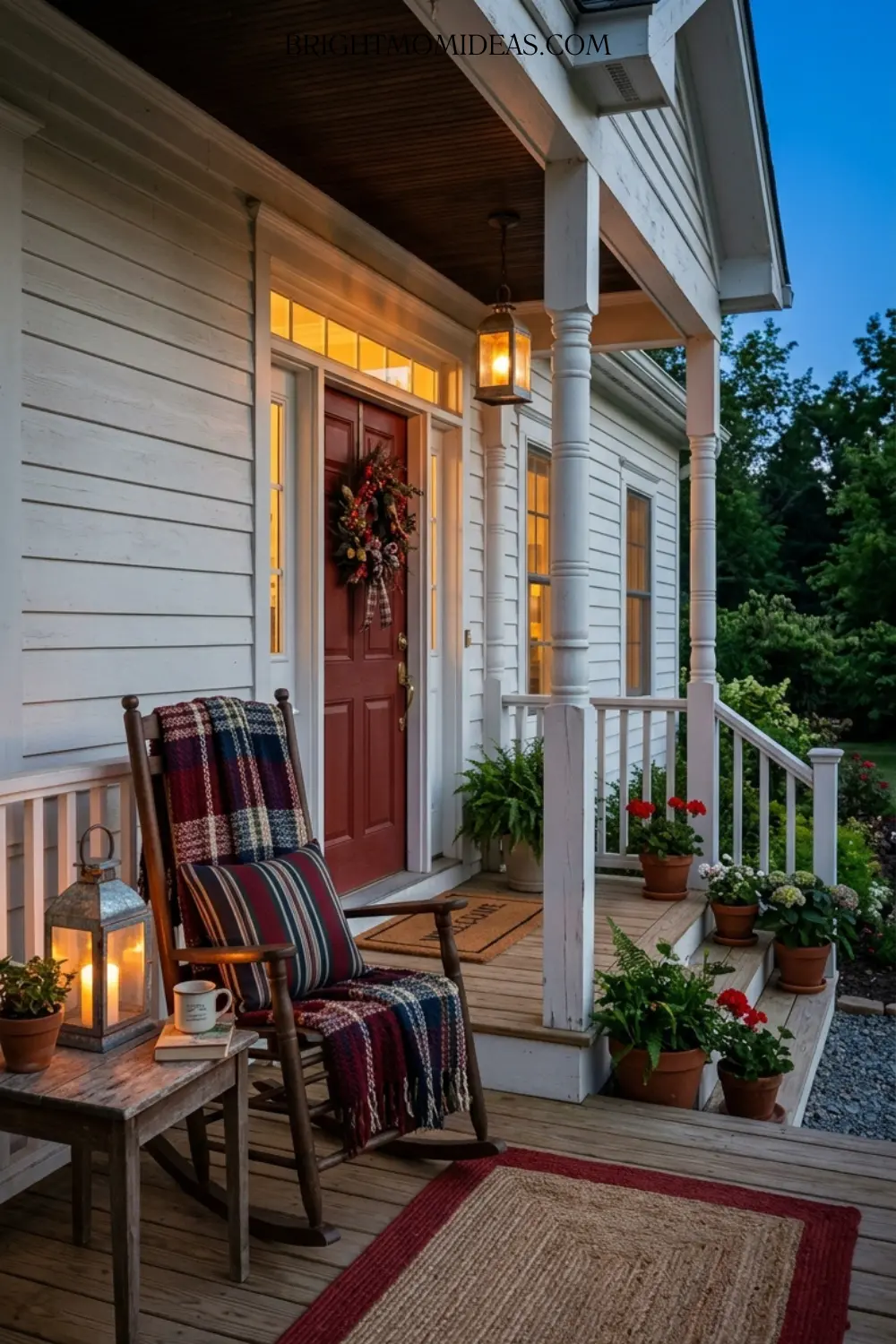 Pair of galvanized metal lanterns with warm amber 
bulbs glowing on either side of front door at dusk
