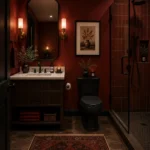 Deep merlot red bathroom walls with brass fixtures and white countertop